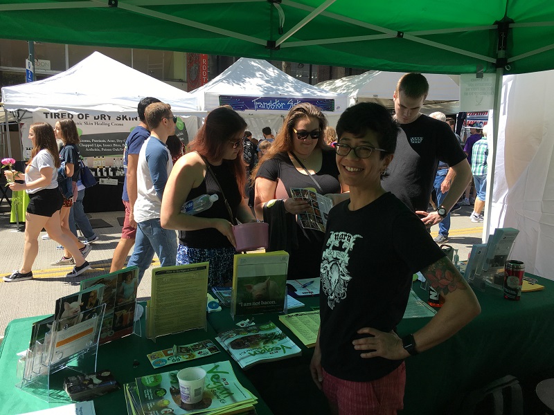 Eva Piccininni tabling for the animals at the U District Streetfair this weekend.